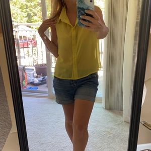 Sheer bright yellow sleeveless button down blouse